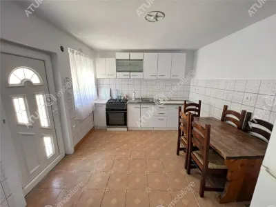 Casa individuala de inchiriat cu 3 camere 3 bucatarii pivnita situata in localitatea Poplaca din Sibiu - foto 7