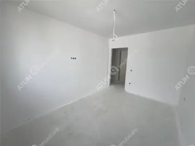 Casa de vanzare cu 4 camere 2 bai 2 balcoane si curte libera de 50 mp situata in zona Calea Cisnadiei din Sibiu - foto 22