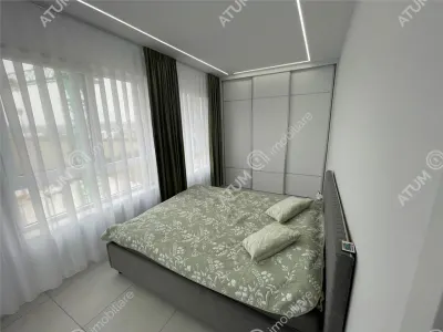 De inchiriat apartament tip penthouse cu 2 camere terasa si loc de parcare in zona Calea Surii Mici din Sibiu - foto 5